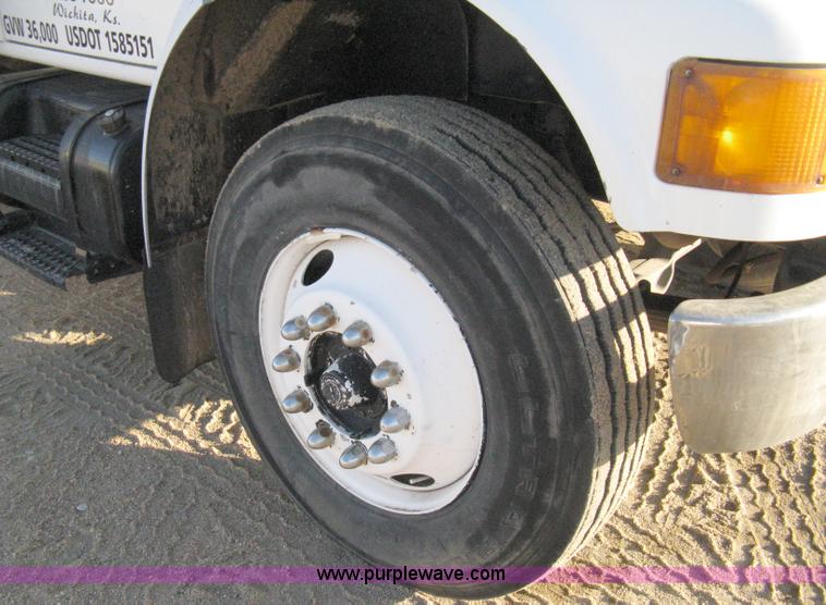 image for item 8149 1995 International 4700 single axle semi truck