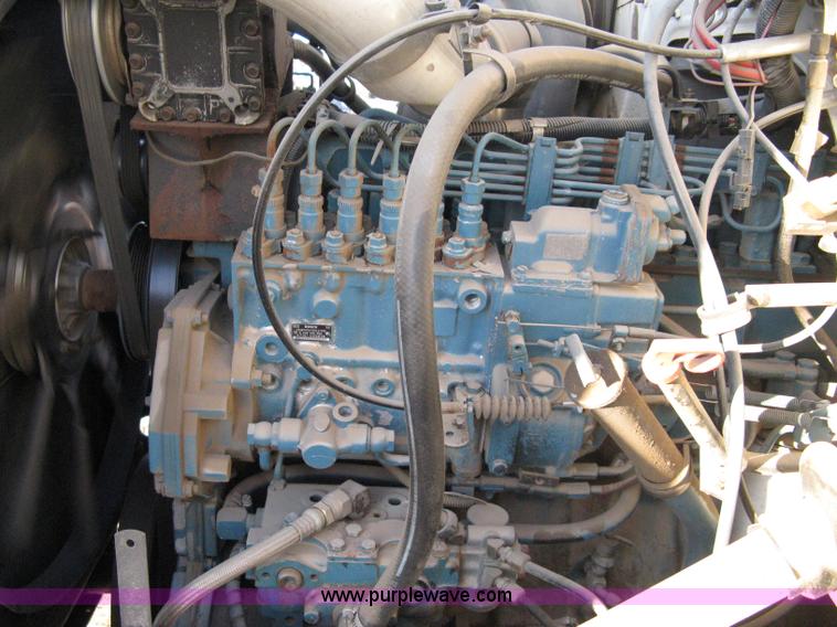 image for item 8149 1995 International 4700 single axle semi truck