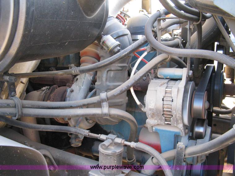 image for item 8149 1995 International 4700 single axle semi truck