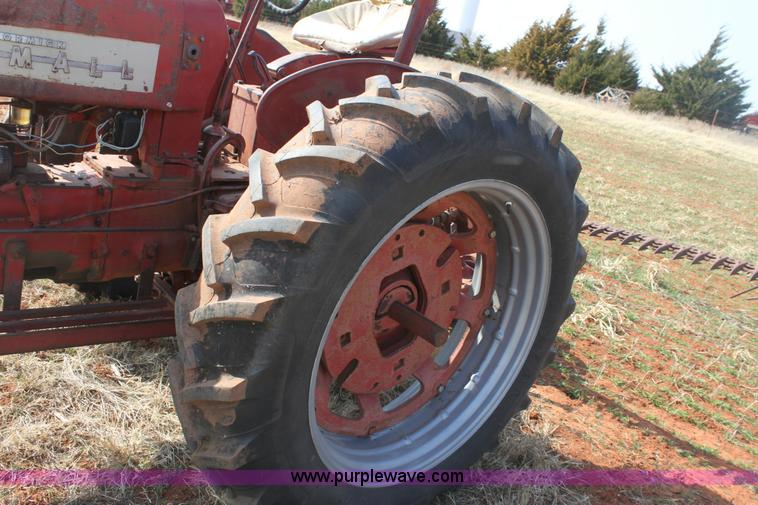 image for item 6901 International Farmall 300 tractor with attachments