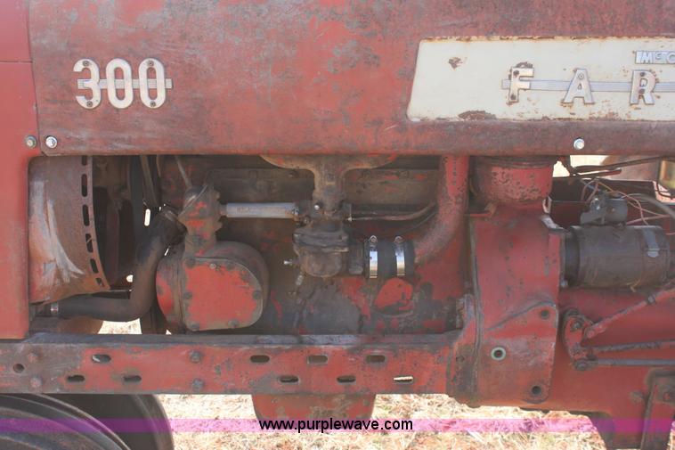 image for item 6901 International Farmall 300 tractor with attachments