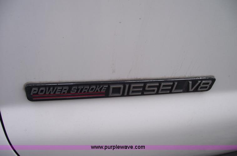 image for item 5452 1999 F450 XL Super Duty flat bed truck