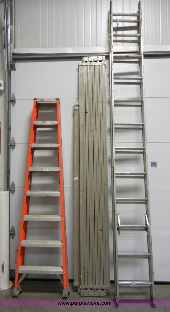 Assorted ladders and extension planks in Manhattan, KS Item 2440 sold Purple Wave