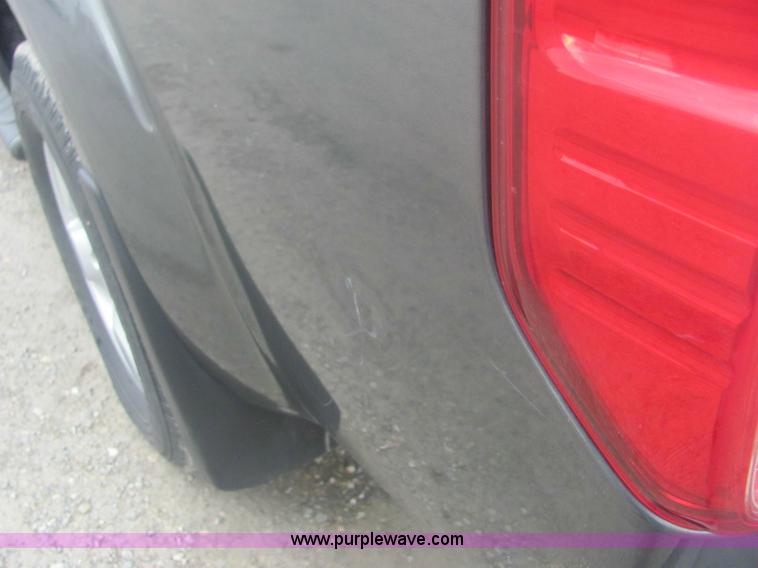 image for item 6959 2006 Nissan Frontier LE crew cab pickup truck