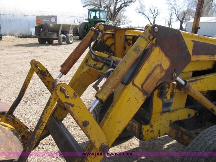 image for item 8239 Massey-Ferguson 30 tractor with loader and backhoe attachment
