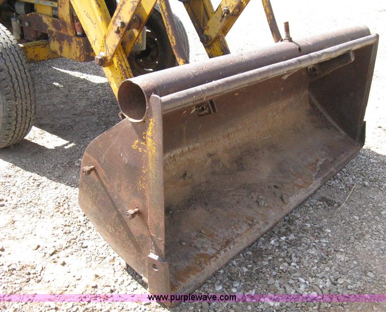 image for item 8239 Massey-Ferguson 30 tractor with loader and backhoe attachment