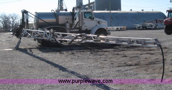 image for item 5393 2000 Sterling L8513 liquid sprayer truck with 90' aluminum booms