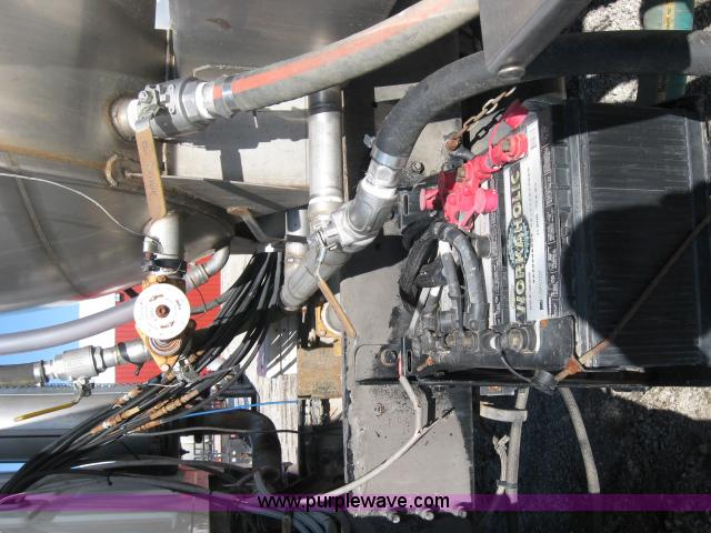 image for item 5393 2000 Sterling L8513 liquid sprayer truck with 90' aluminum booms