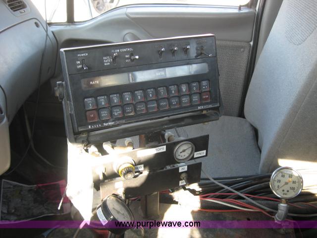 image for item 5393 2000 Sterling L8513 liquid sprayer truck with 90' aluminum booms