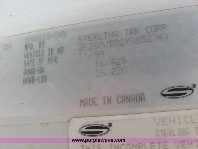 image for item 5393 2000 Sterling L8513 liquid sprayer truck with 90' aluminum booms