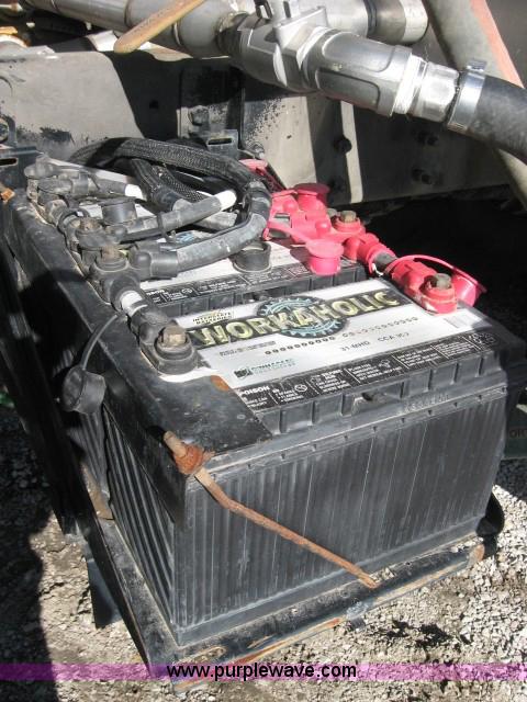 image for item 5393 2000 Sterling L8513 liquid sprayer truck with 90' aluminum booms