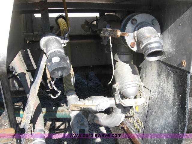 image for item 5393 2000 Sterling L8513 liquid sprayer truck with 90' aluminum booms