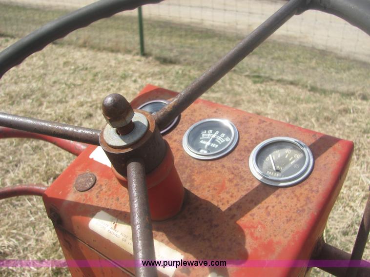 image for item 6983 New Holland 1047 self propelled small square stacker