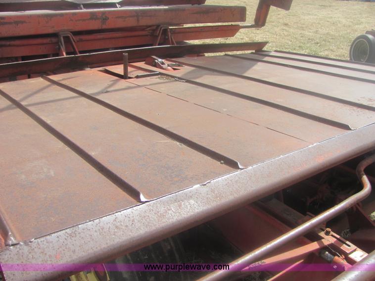 image for item 6983 New Holland 1047 self propelled small square stacker