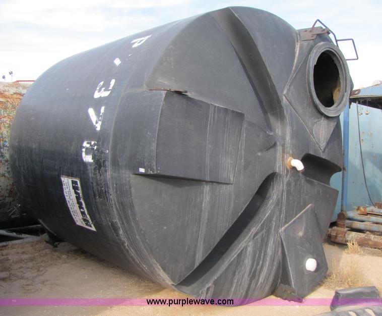 image for item 3532 Approximately 7,000 gallon poly tank with base