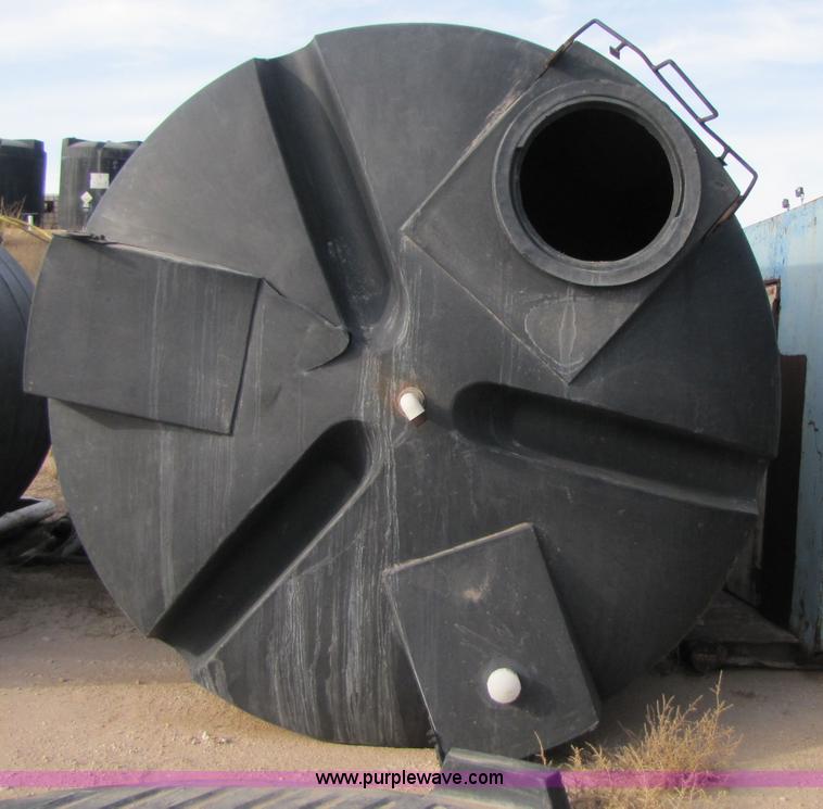 image for item 3532 Approximately 7,000 gallon poly tank with base