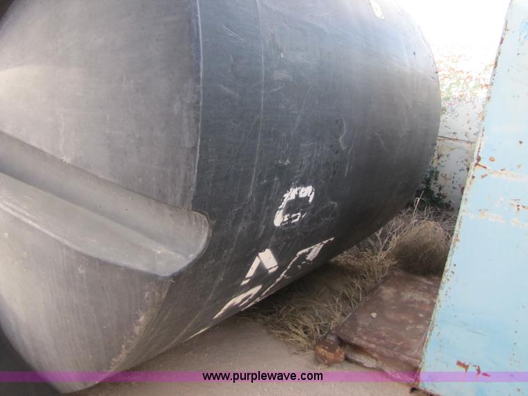 image for item 3532 Approximately 7,000 gallon poly tank with base