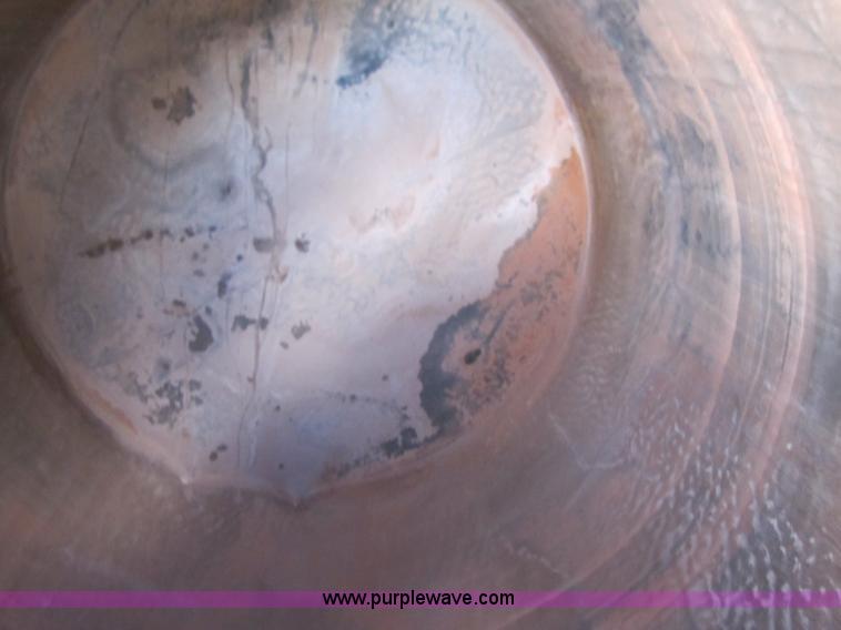 image for item 3532 Approximately 7,000 gallon poly tank with base