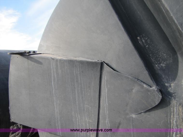 image for item 3532 Approximately 7,000 gallon poly tank with base