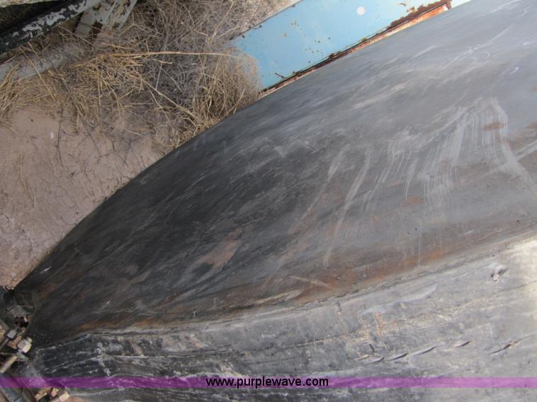 image for item 3532 Approximately 7,000 gallon poly tank with base