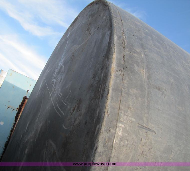 image for item 3532 Approximately 7,000 gallon poly tank with base