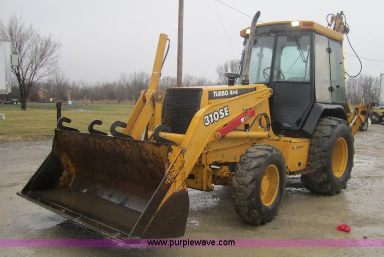 image for item 3695 1999 John Deere 3105E MFWD backhoe