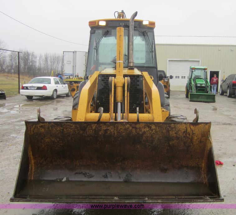 image for item 3695 1999 John Deere 3105E MFWD backhoe