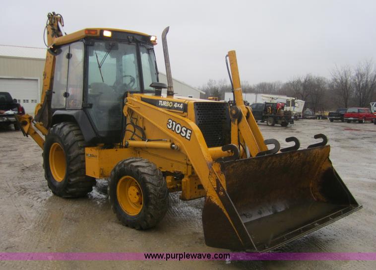 image for item 3695 1999 John Deere 3105E MFWD backhoe
