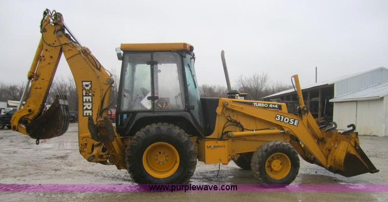 image for item 3695 1999 John Deere 3105E MFWD backhoe