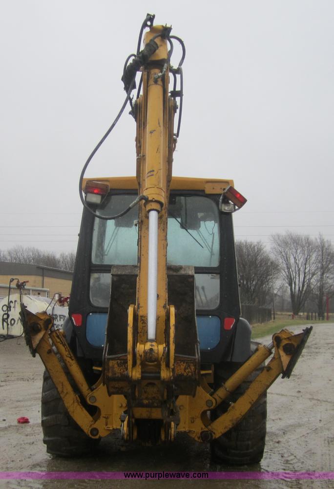 image for item 3695 1999 John Deere 3105E MFWD backhoe