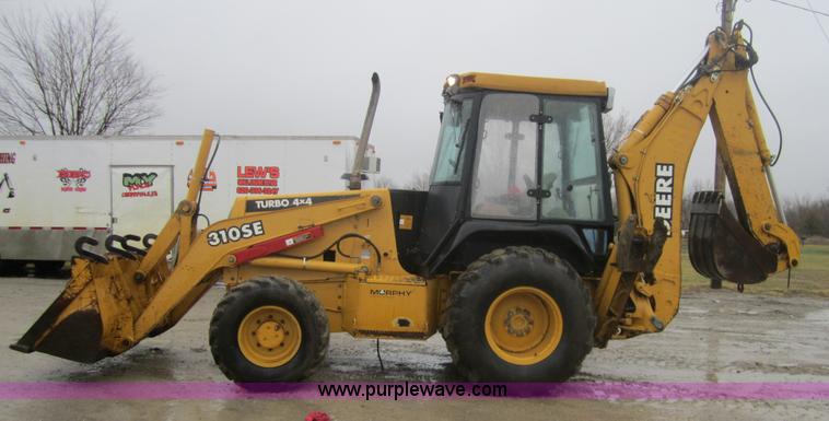 image for item 3695 1999 John Deere 3105E MFWD backhoe