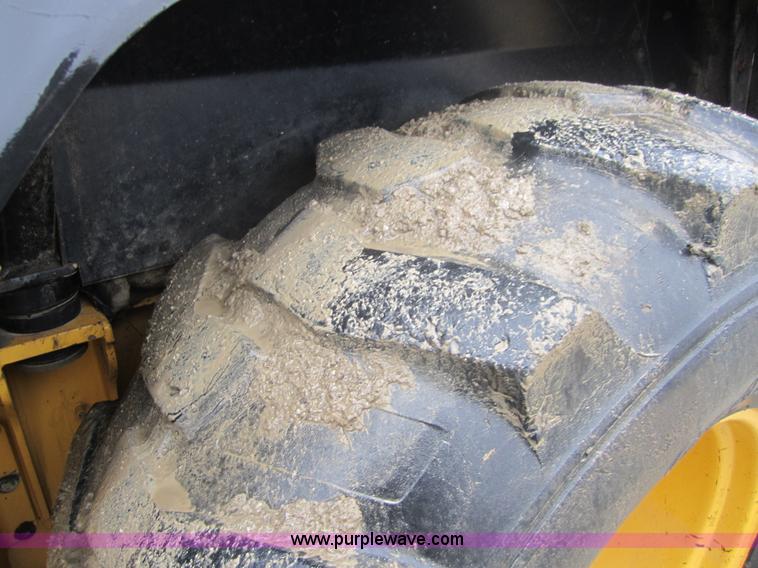 image for item 3695 1999 John Deere 3105E MFWD backhoe