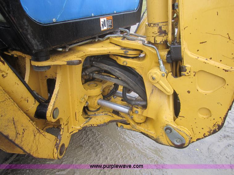 image for item 3695 1999 John Deere 3105E MFWD backhoe