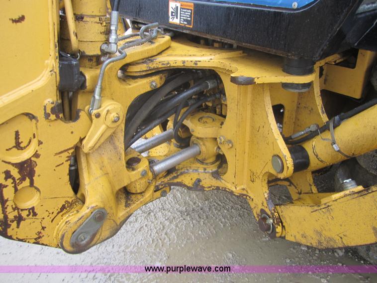 image for item 3695 1999 John Deere 3105E MFWD backhoe