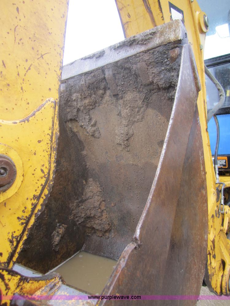image for item 3695 1999 John Deere 3105E MFWD backhoe