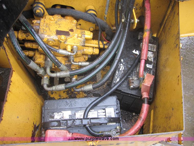 image for item 3695 1999 John Deere 3105E MFWD backhoe