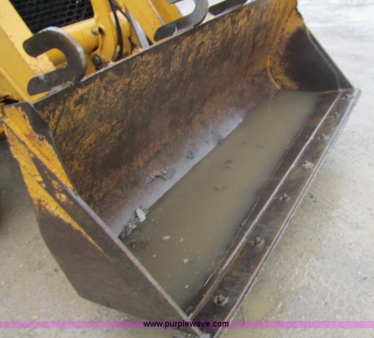 image for item 3695 1999 John Deere 3105E MFWD backhoe