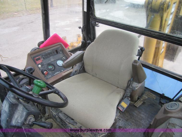 image for item 3695 1999 John Deere 3105E MFWD backhoe