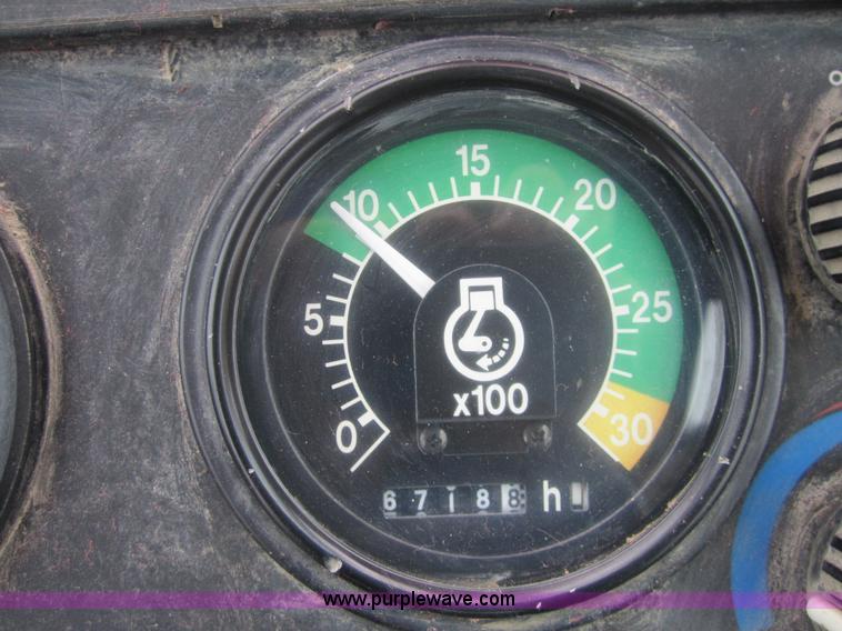 image for item 3695 1999 John Deere 3105E MFWD backhoe