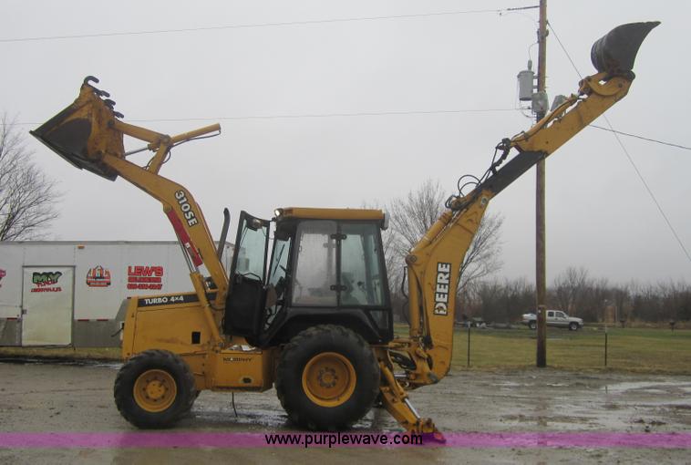 image for item 3695 1999 John Deere 3105E MFWD backhoe