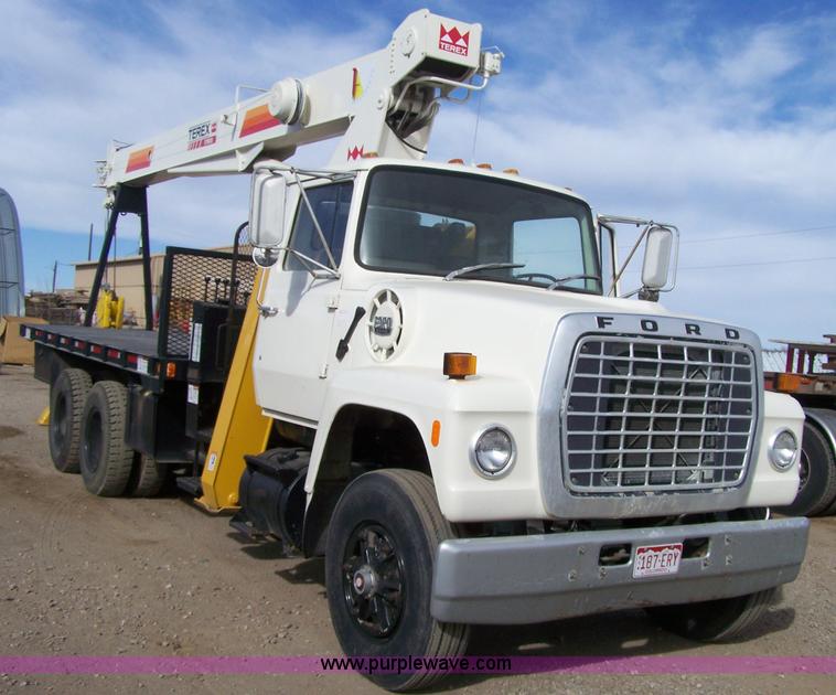 image for item 8083 1984 Ford LT8000 semi truck with Terex RO boom