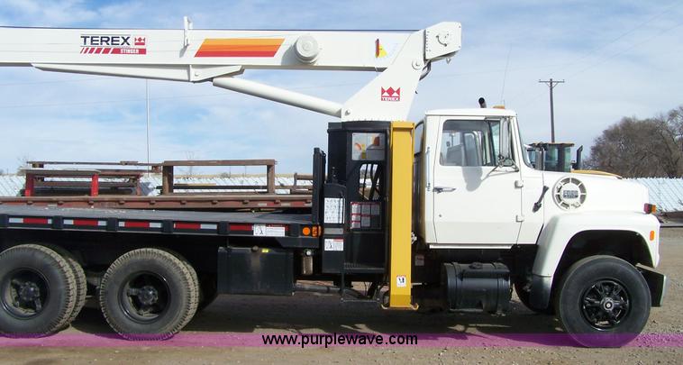 image for item 8083 1984 Ford LT8000 semi truck with Terex RO boom