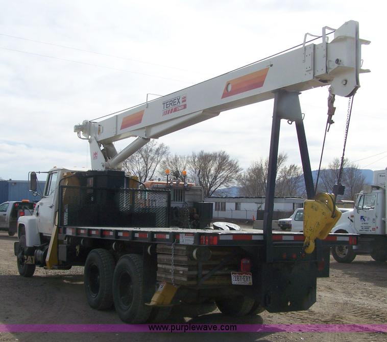 image for item 8083 1984 Ford LT8000 semi truck with Terex RO boom