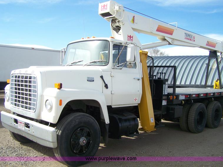 image for item 8083 1984 Ford LT8000 semi truck with Terex RO boom