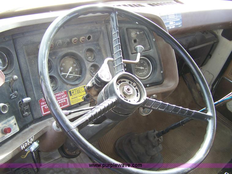 image for item 8083 1984 Ford LT8000 semi truck with Terex RO boom