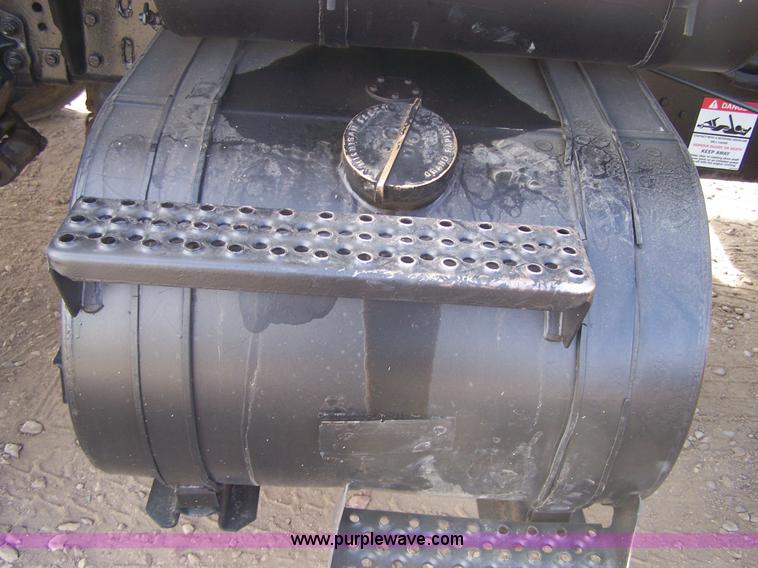 image for item 8083 1984 Ford LT8000 semi truck with Terex RO boom