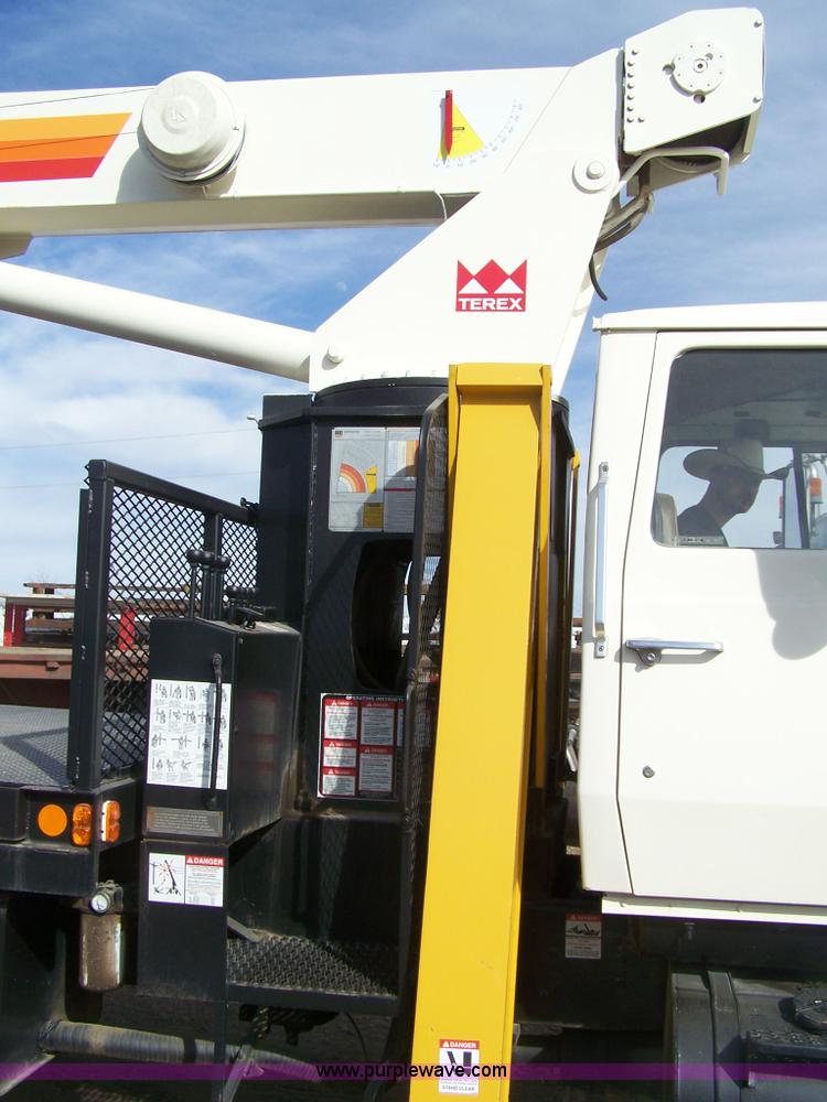 image for item 8083 1984 Ford LT8000 semi truck with Terex RO boom