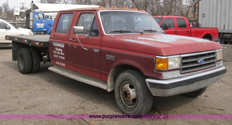 image for item 8012 1991 Ford F350 Custom XLT Lariat four-door flatbed dually pickup