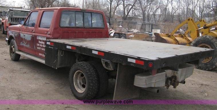 image for item 8012 1991 Ford F350 Custom XLT Lariat four-door flatbed dually pickup