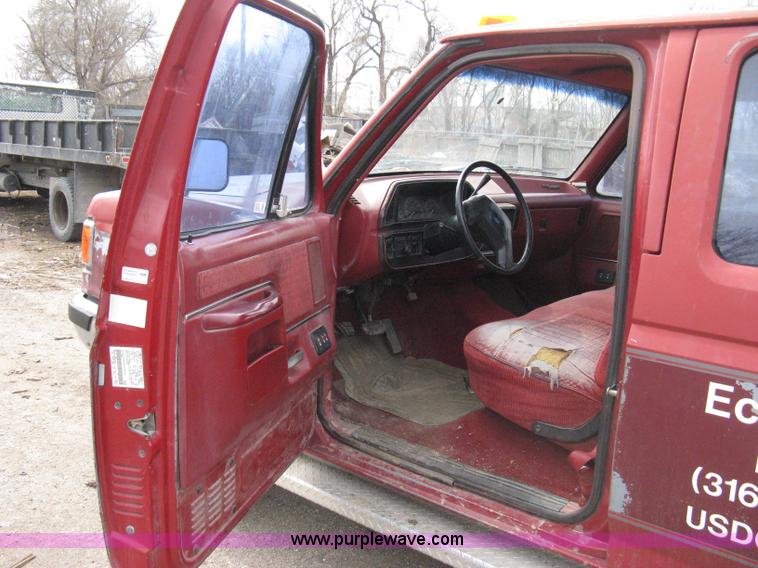 image for item 8012 1991 Ford F350 Custom XLT Lariat four-door flatbed dually pickup